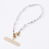 UNIQ Coehl Perla Handstrap uniwersalny    sznurek do telefonu na rękę biały/white pearl